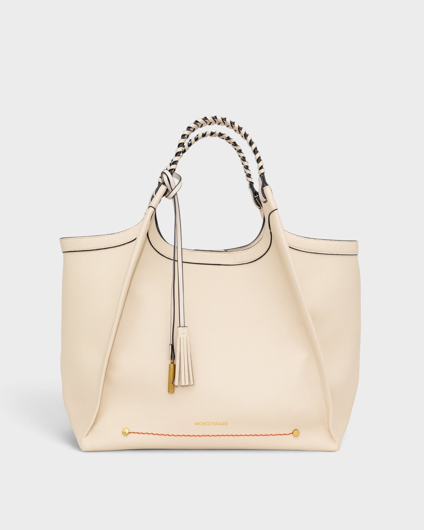 Montemaré Sedona work tote in cream pebbled vegan leather with hand-braided handles and a signature whistle tassel.