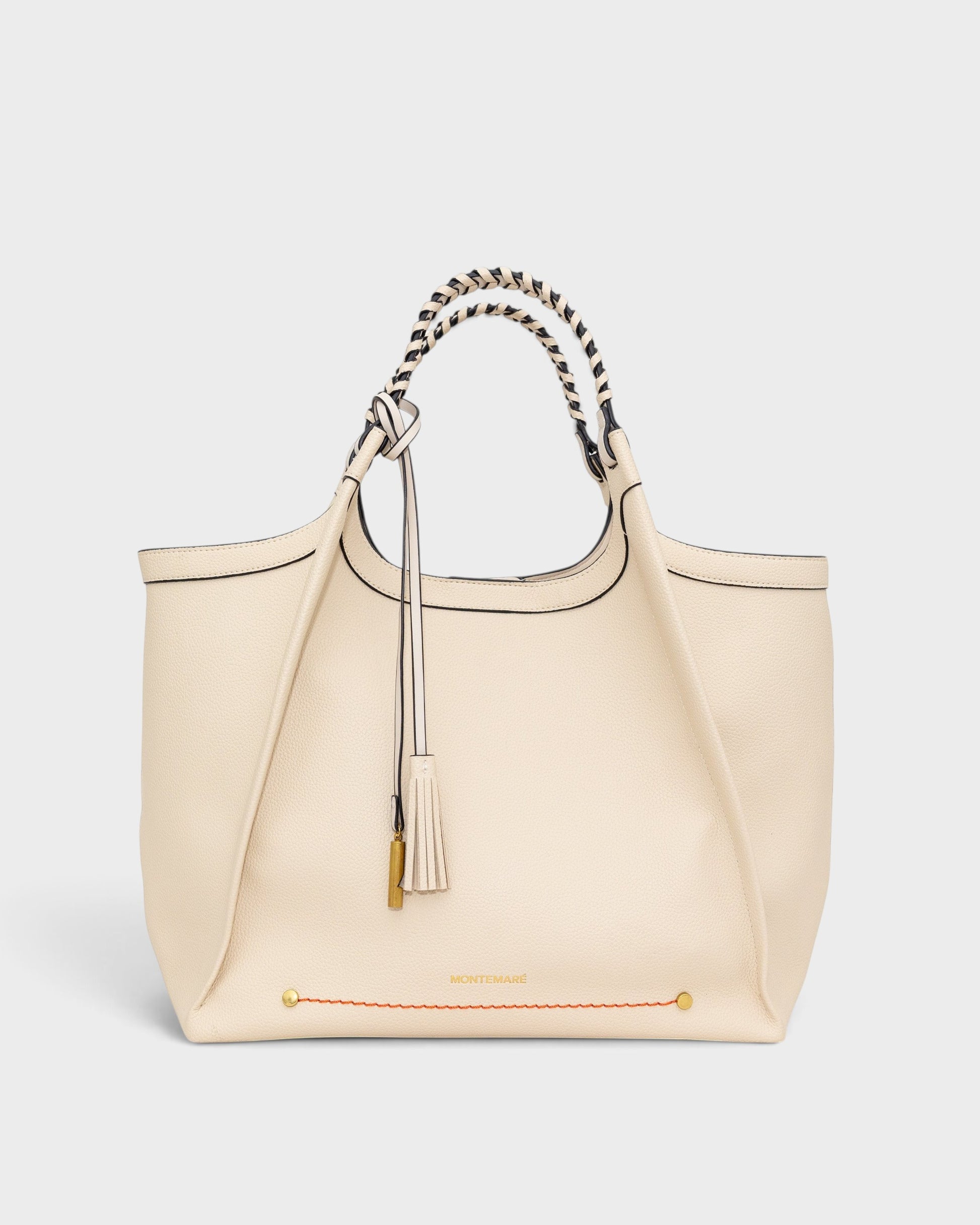 Montemaré Sedona work tote in cream pebbled vegan leather with hand-braided handles and a signature whistle tassel.