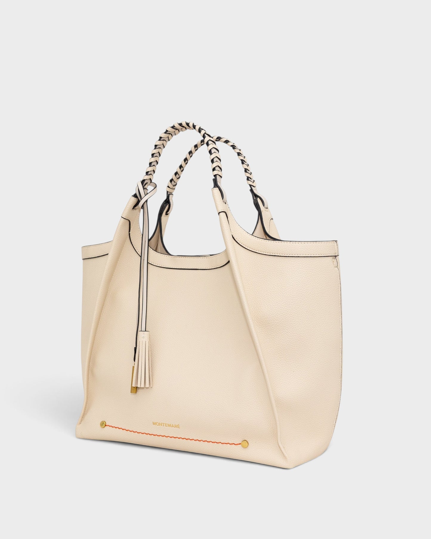 Montemaré Sedona Work Tote in cream pebbled vegan leather with hand-braided handles and a signature whistle tassel.