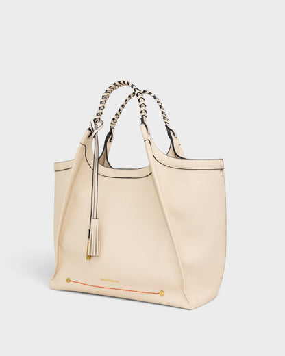 Montemaré Sedona work tote in cream vegan leather with hand-braided handles and signature whistle tassel