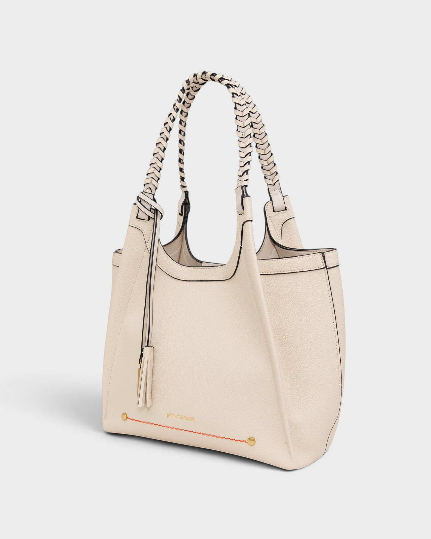 Montemaré Sedona tote bag in cream vegan leather with hand-braided shoulder straps and signature whistle tassel