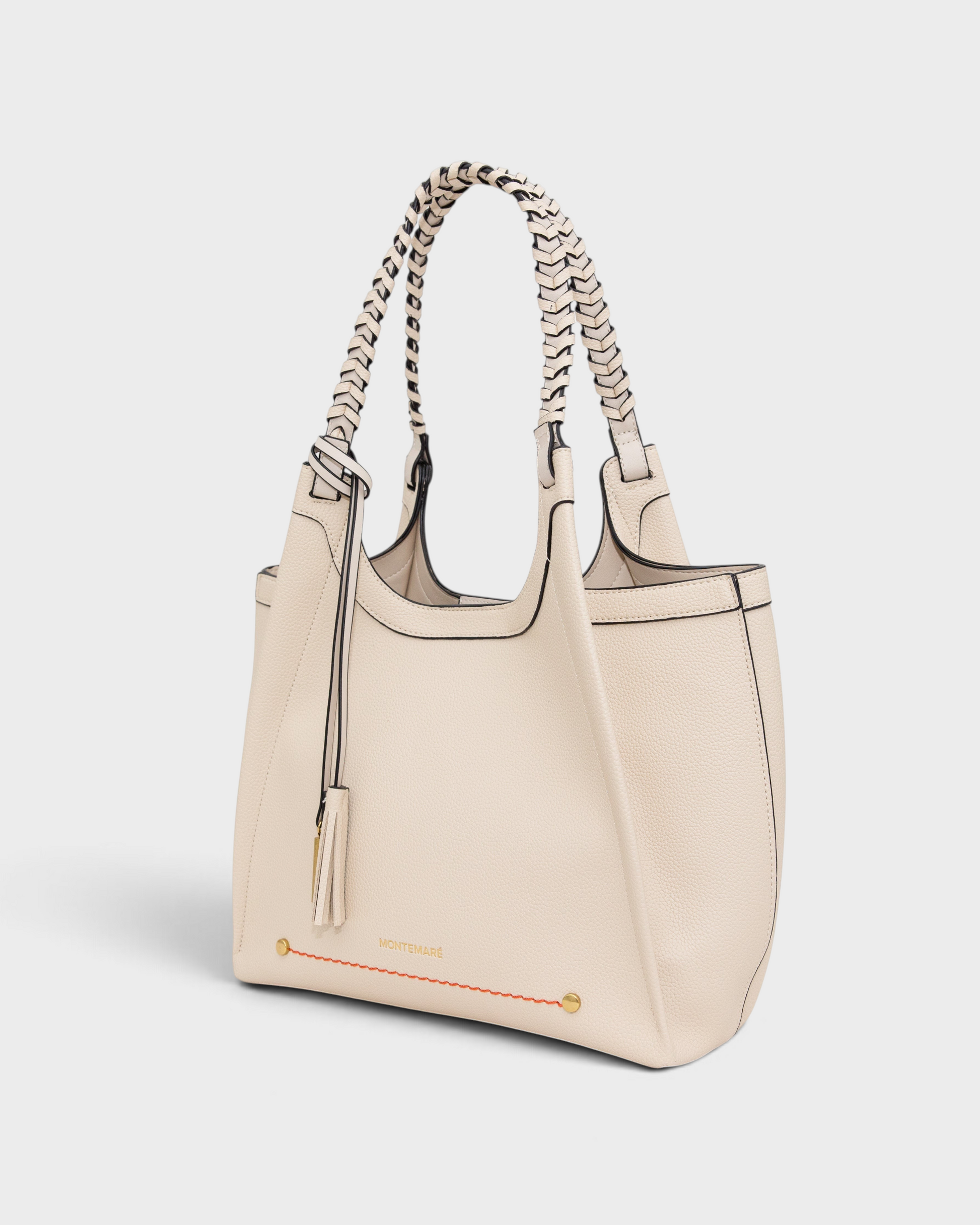 Montemaré Sedona tote bag in cream vegan leather with hand-braided shoulder straps and signature whistle tassel