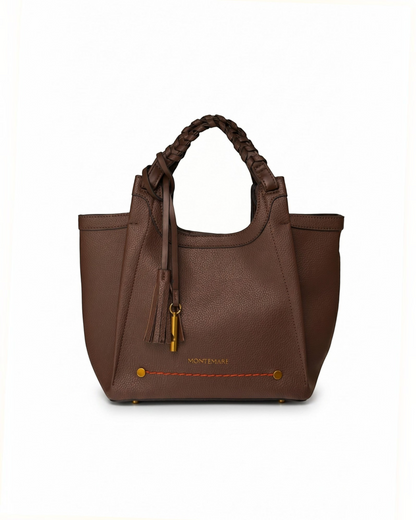 Montemaré Sedona Crossbody bag in brown pebbled vegan leather with a braided handle and signature whistle tassel.