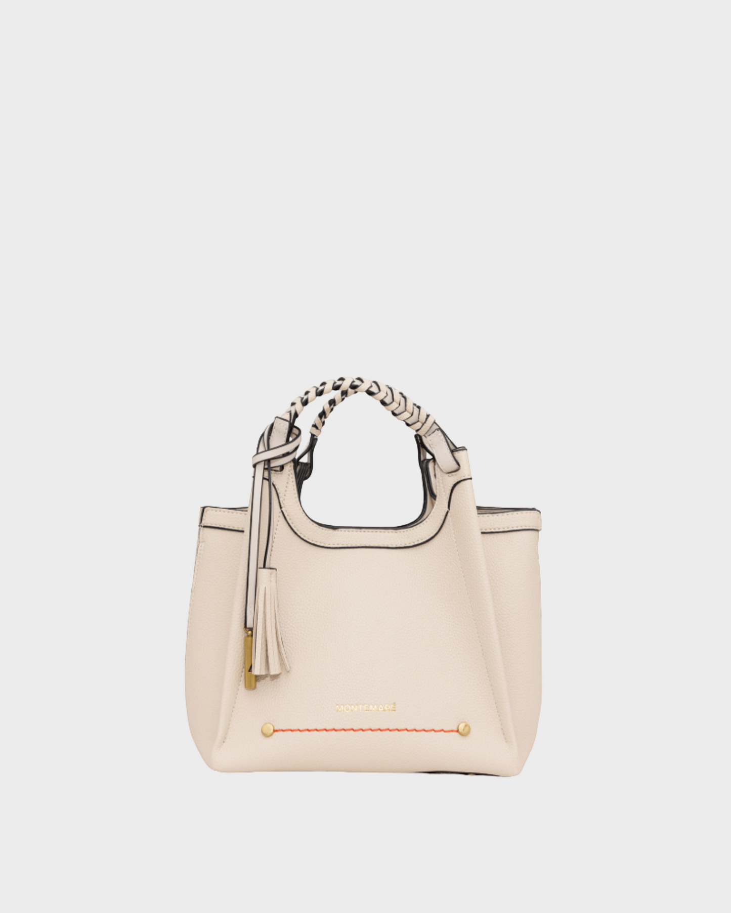Montemaré Sedona Crossbody bag in cream pebbled vegan leather with a braided top handle and signature whistle tassel.