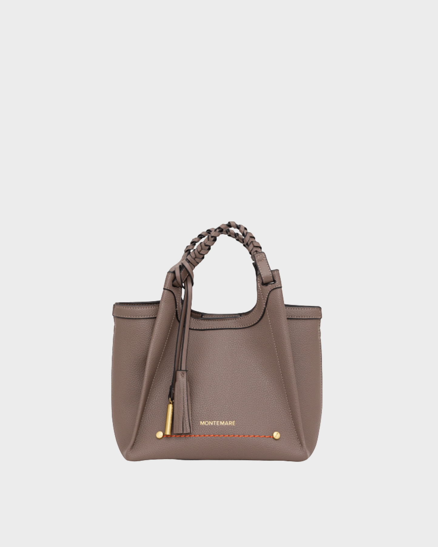 Montemaré Sedona crossbody bag in taupe pebbled vegan leather with a braided handle and signature whistle tassel.