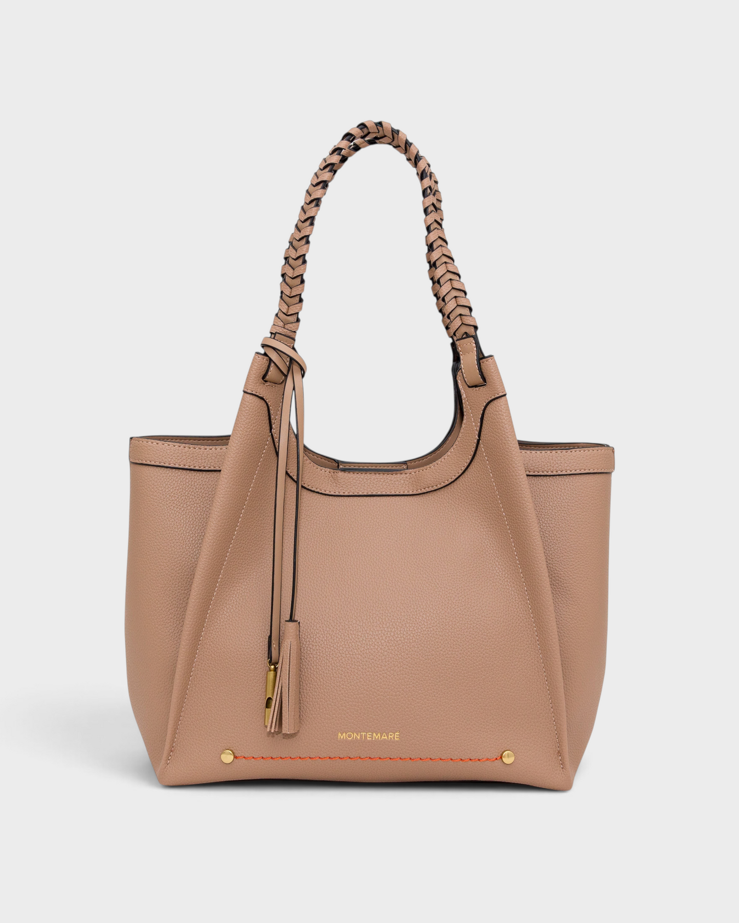 Montemaré Sedona tote bag in tan vegan leather with hand-braided straps, orange stitching, and signature whistle tassel