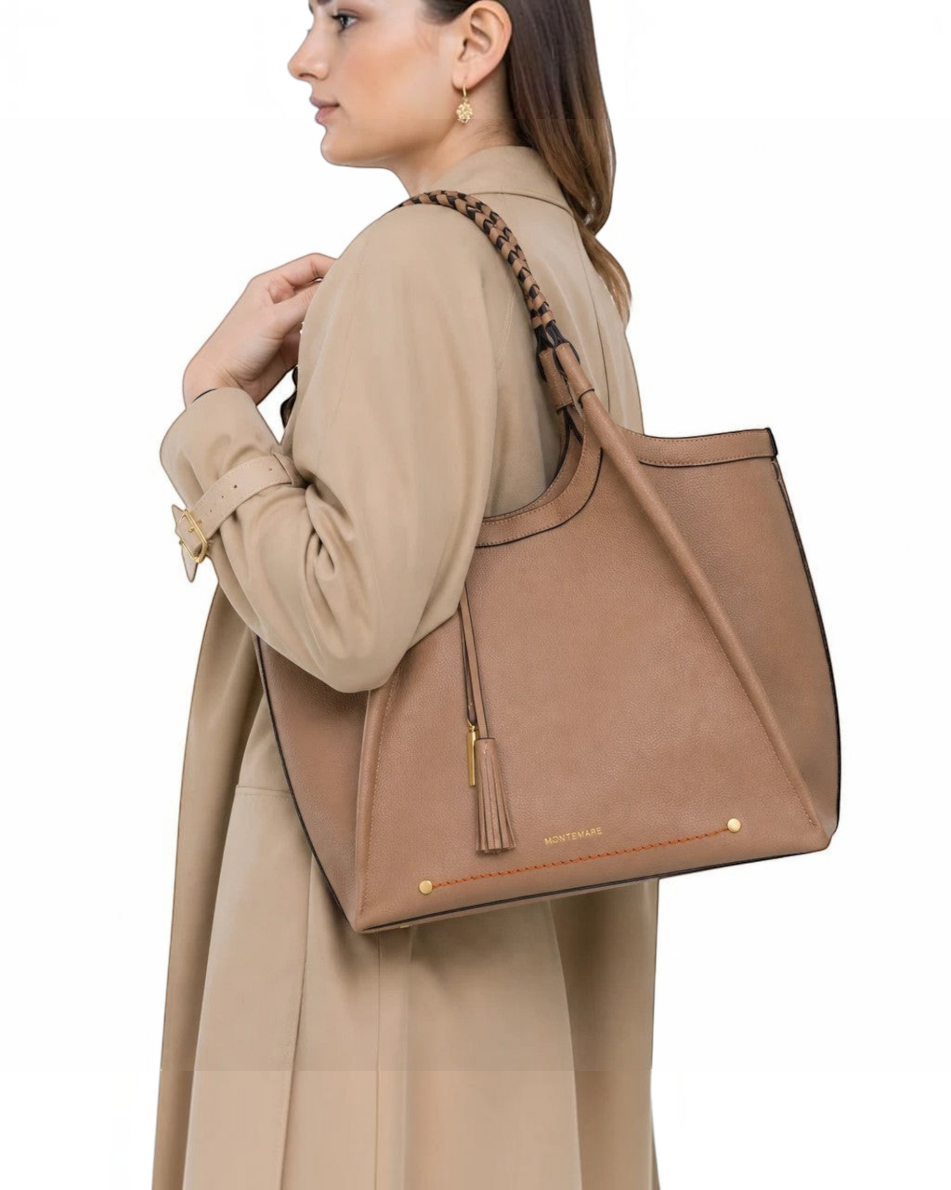 Montemaré Sedona tote bag in tan vegan leather with hand-braided straps and a signature whistle tassel on a model