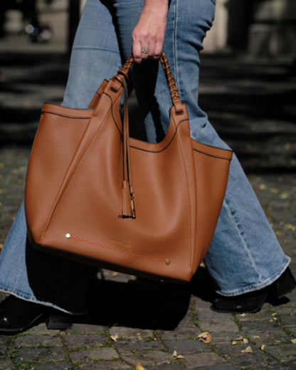 Montemaré Sedona vegan leather work tote in tan with hand-braided handles and signature whistle tassel