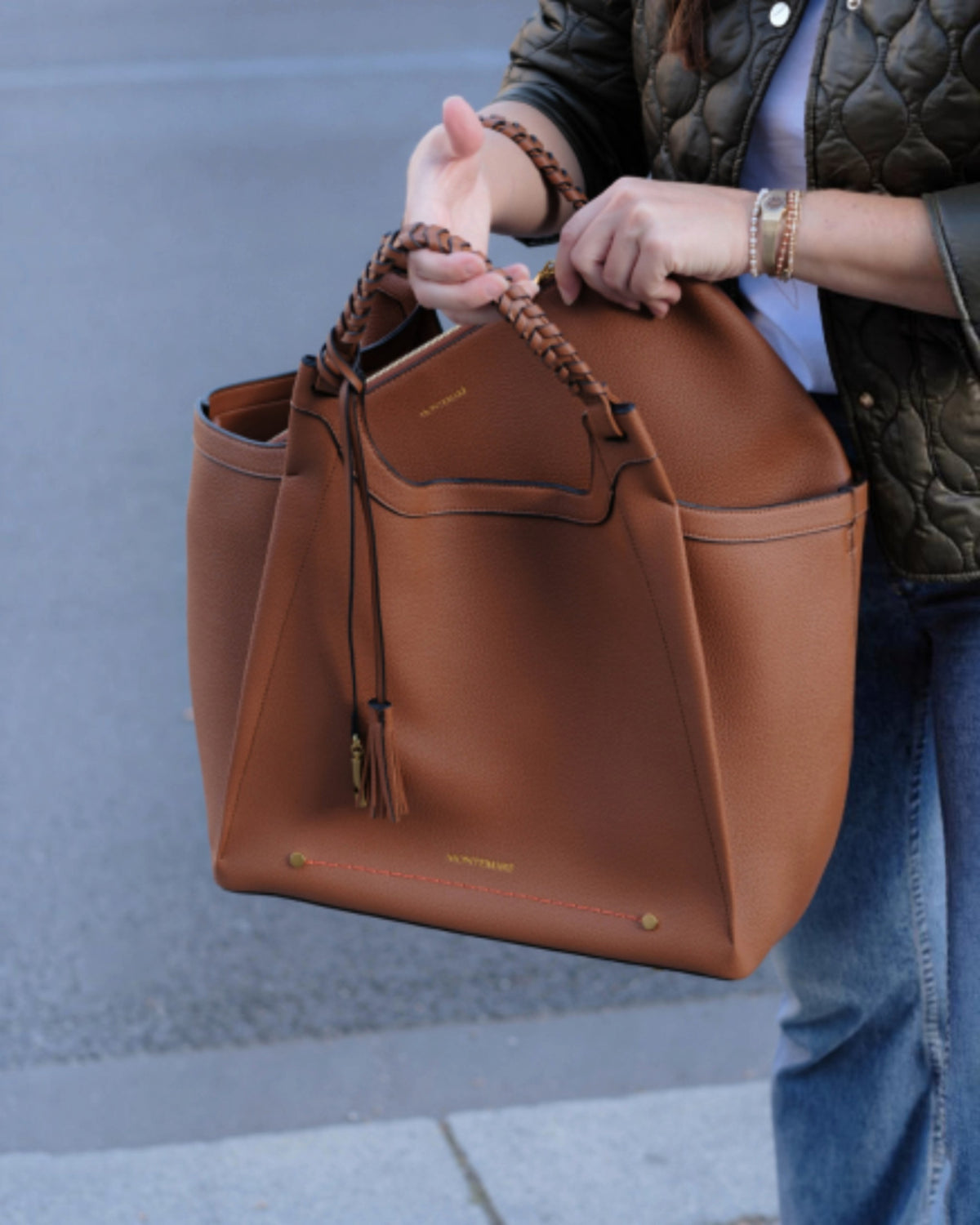 Montemaré Sedona work tote in tan vegan leather with hand-braided handles and signature tassel detail