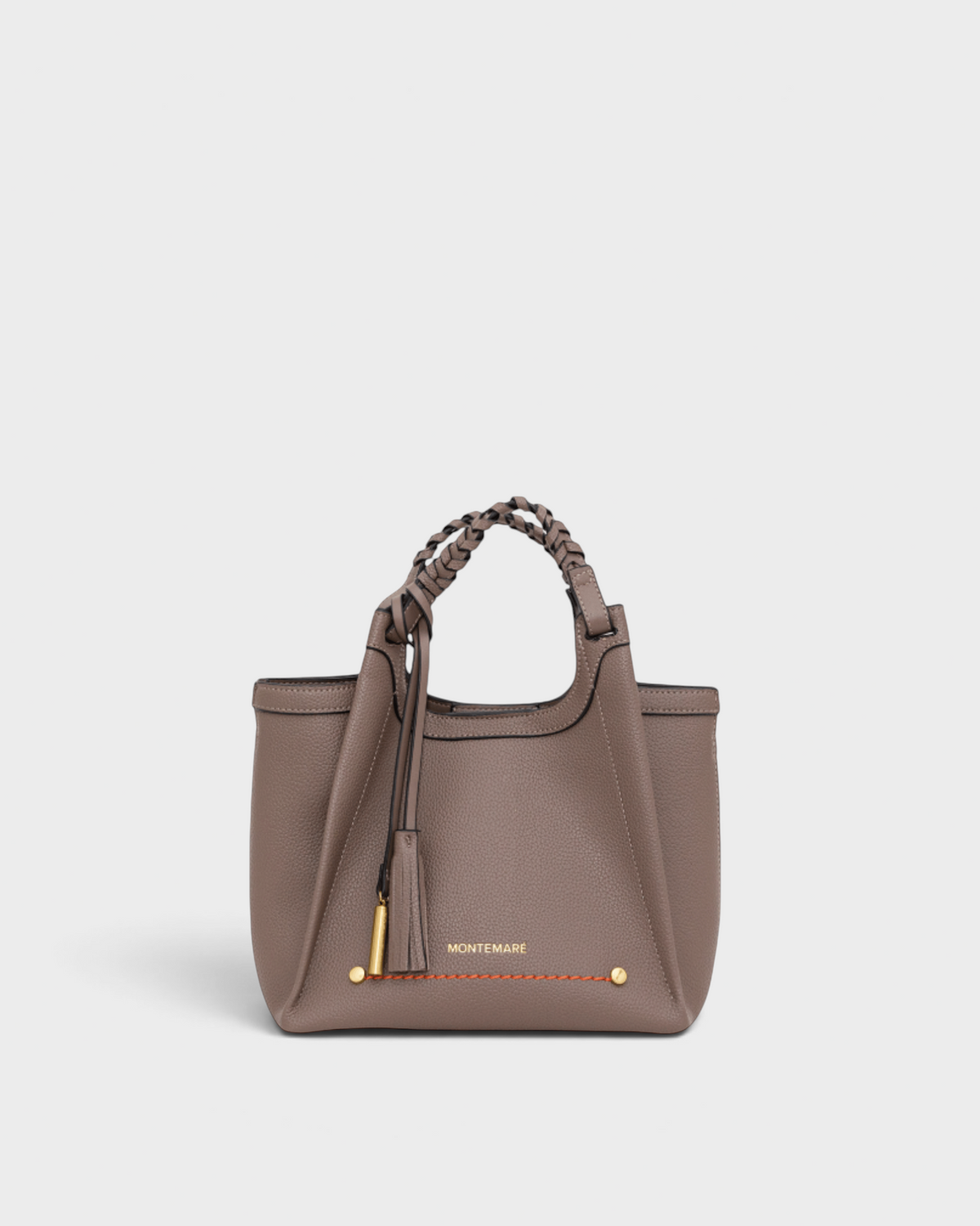 Montemaré Sedona crossbody bag in taupe pebbled vegan leather with a braided handle and signature whistle tassel.