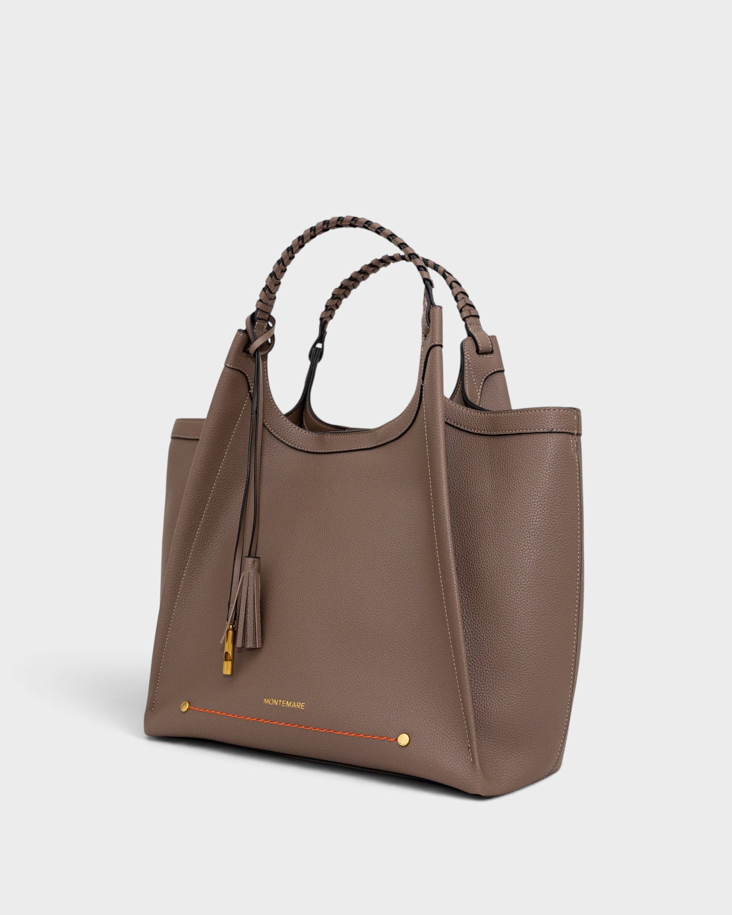 Montemaré Sedona Work Tote in taupe pebbled vegan leather with hand-braided handles and signature whistle tassel.