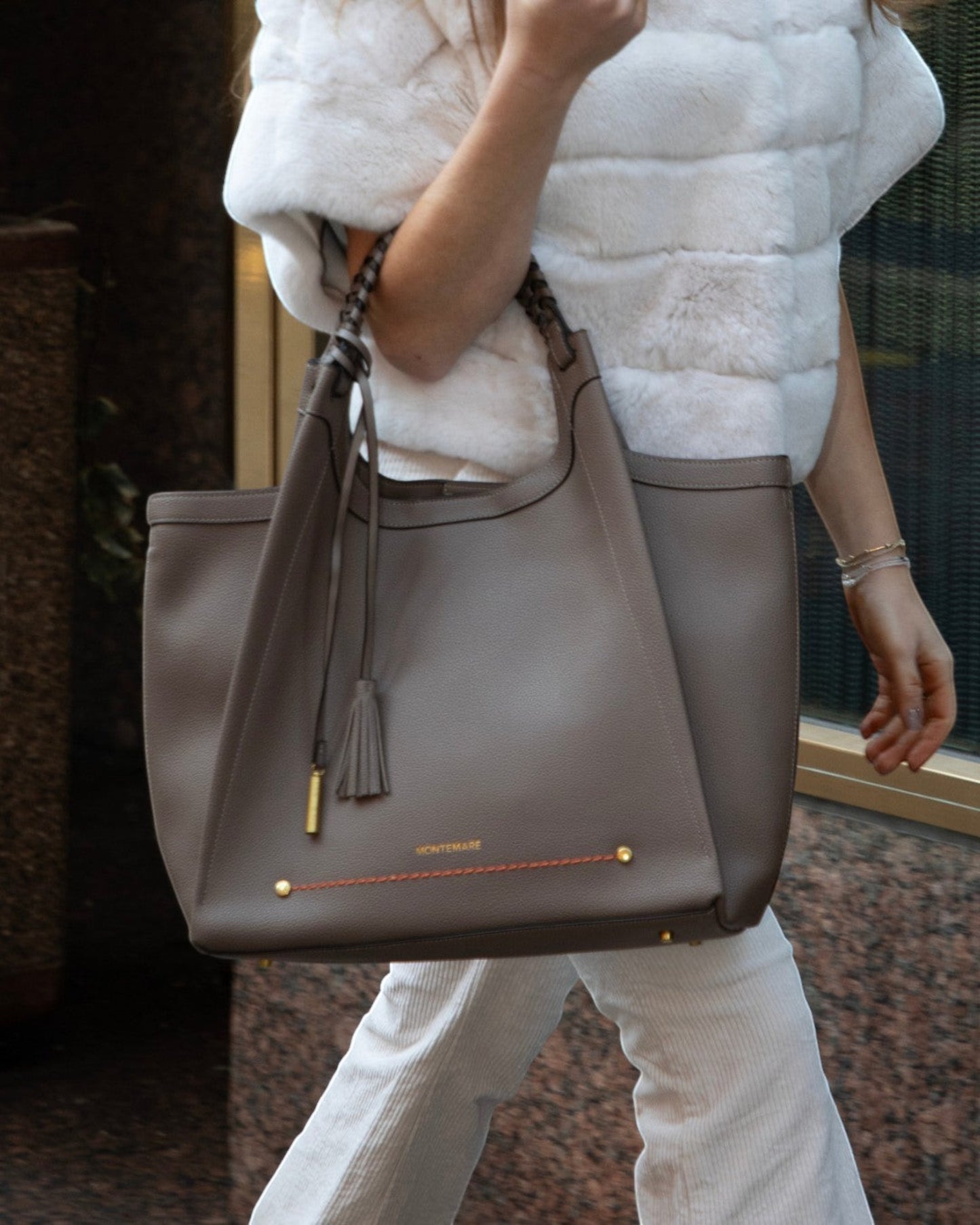 Montemaré Sedona work tote in taupe pebbled vegan leather with braided handles and signature whistle tassel