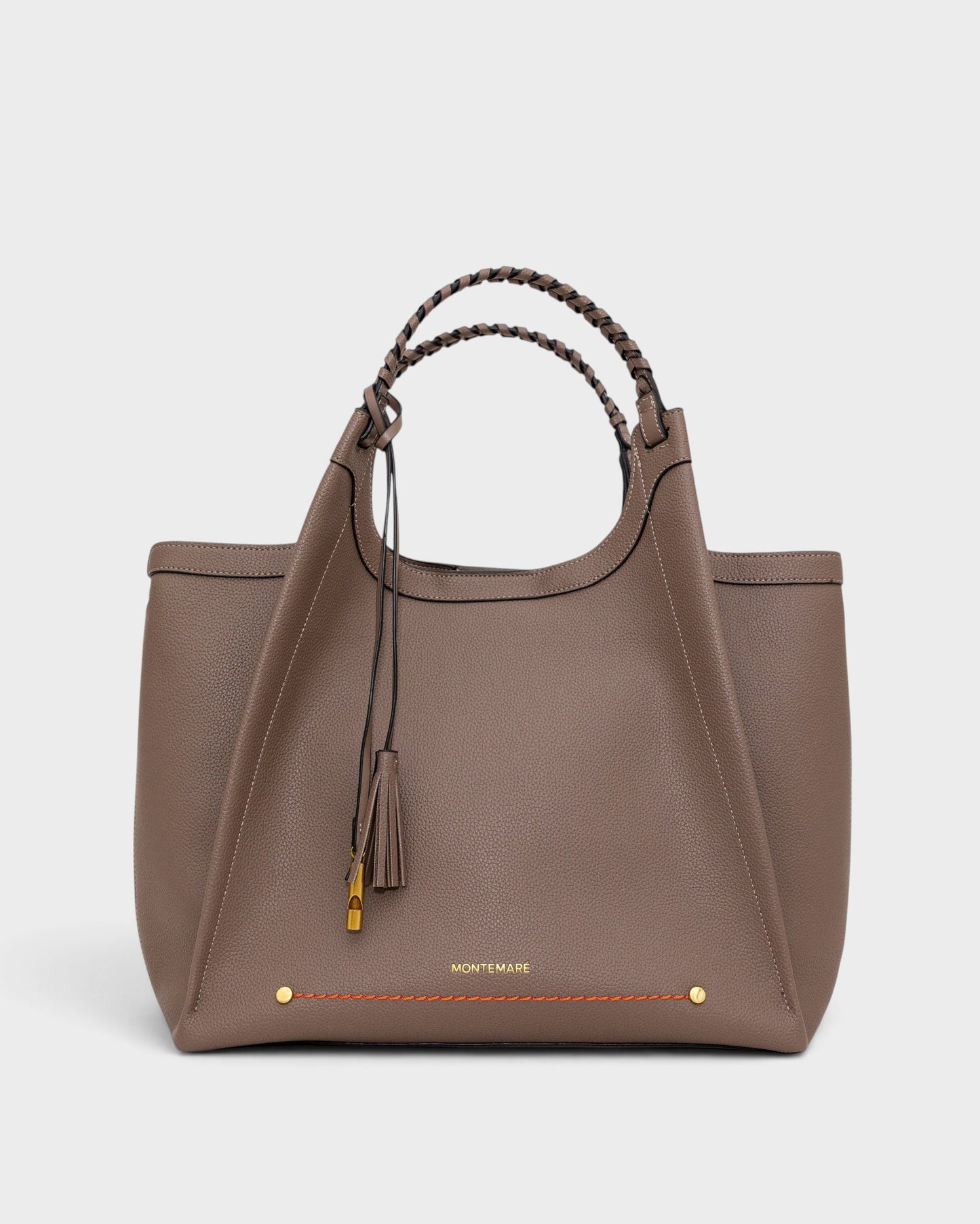 Montemaré Sedona work tote in taupe pebbled vegan leather with hand-braided handles and signature whistle tassel.
