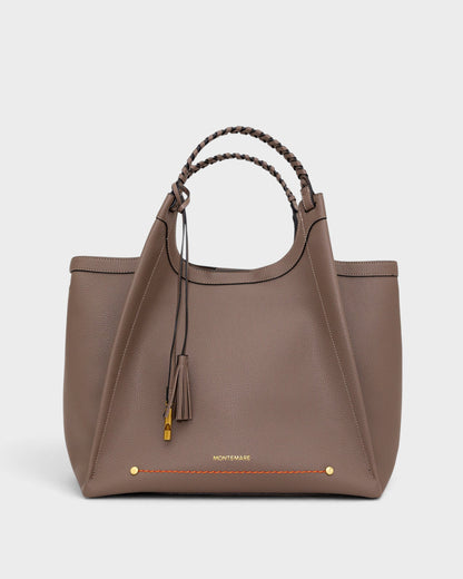 Montemaré Sedona work tote in taupe pebbled vegan leather with hand-braided handles and signature whistle tassel.