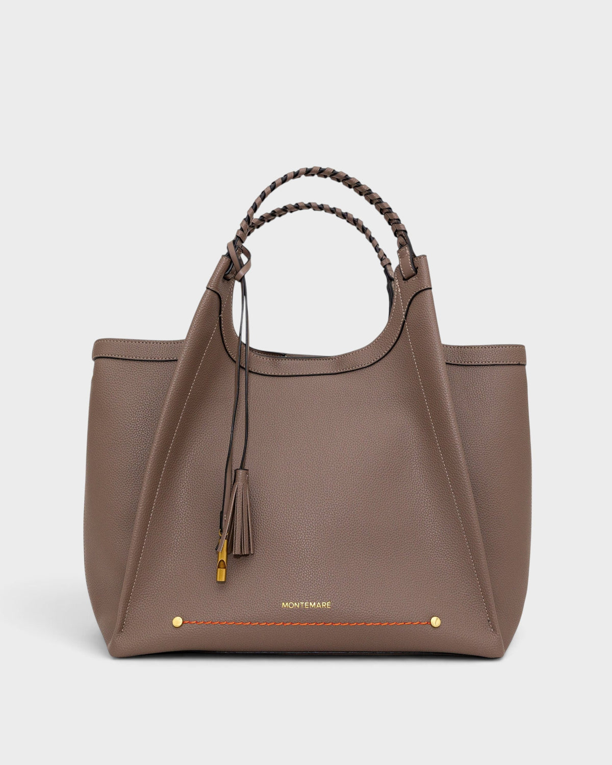 Montemaré Sedona work tote in taupe vegan leather with hand-braided handles and signature whistle tassel detail.
