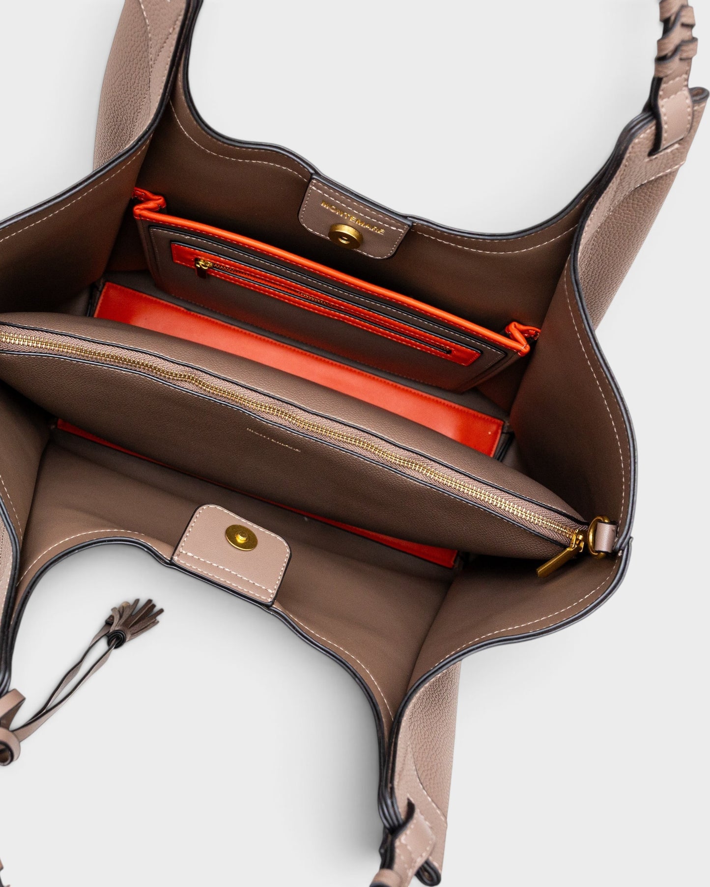 Montemaré Sedona Work Tote in pebbled vegan leather with orange interior accents, laptop sleeve, and braided handles.