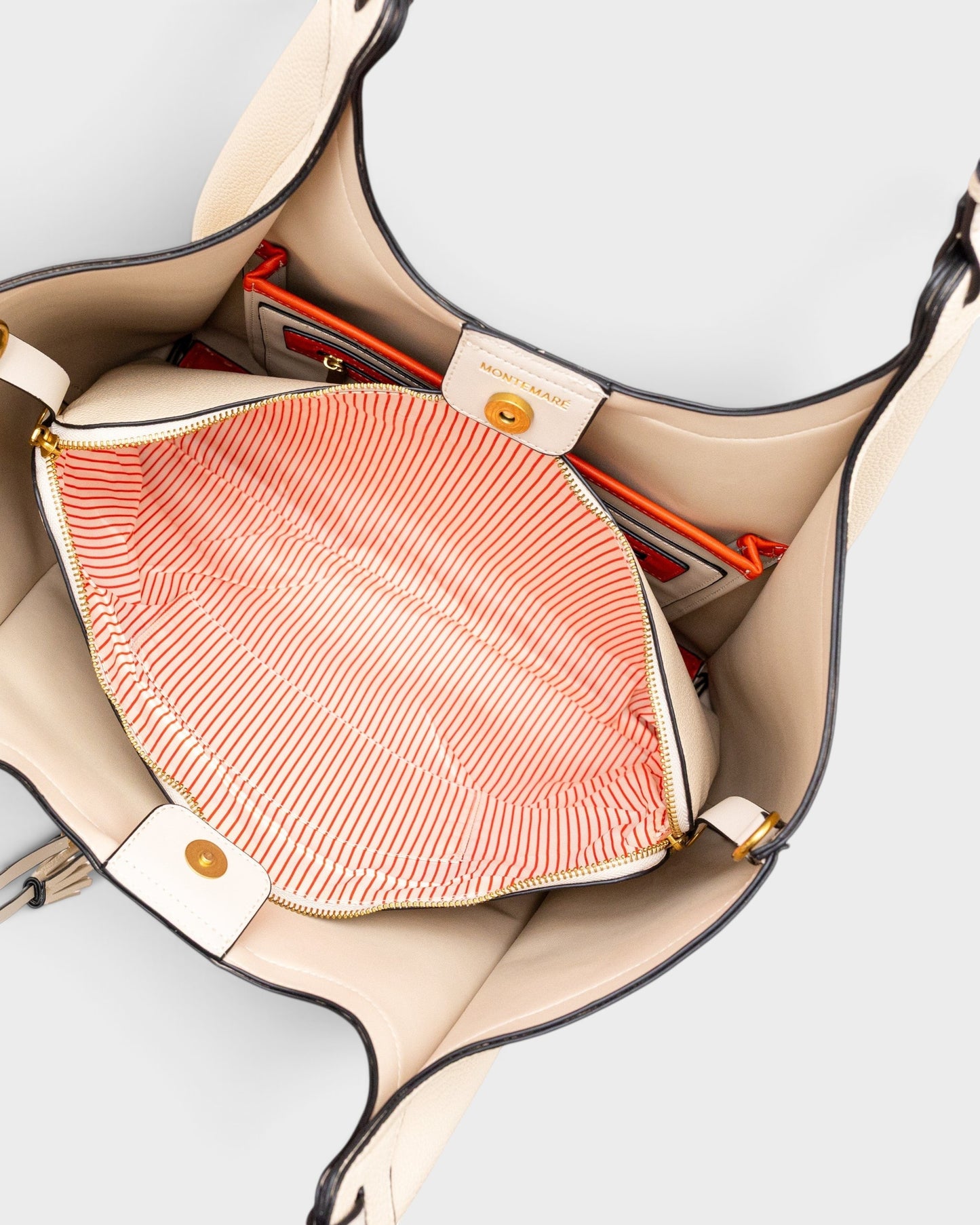 Montemaré Sedona Work Tote in beige vegan leather with orange interior accents, laptop sleeve, and braided handles.