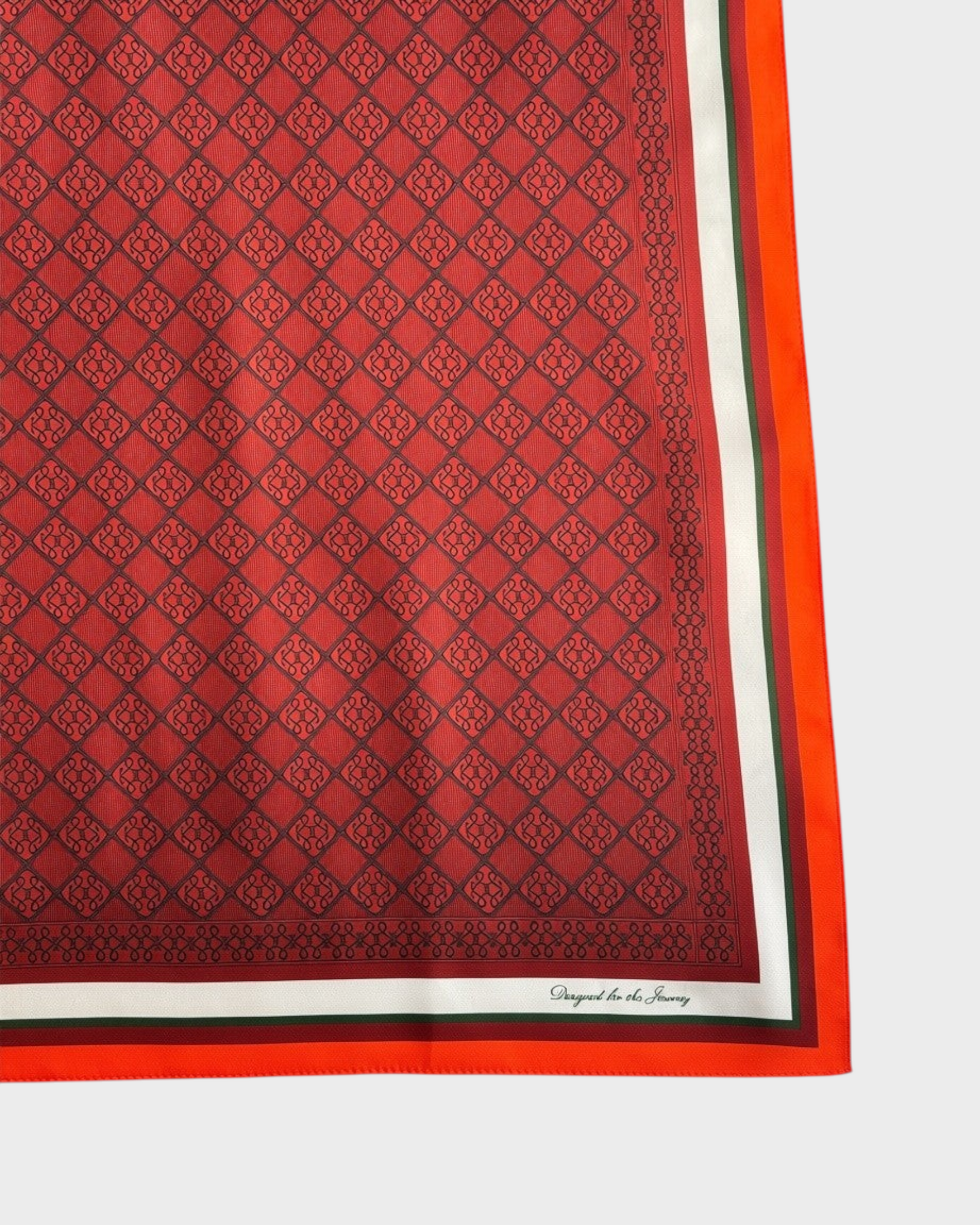 Montemaré silk square scarf in red with a signature grid pattern, orange border, and heritage-inspired details.