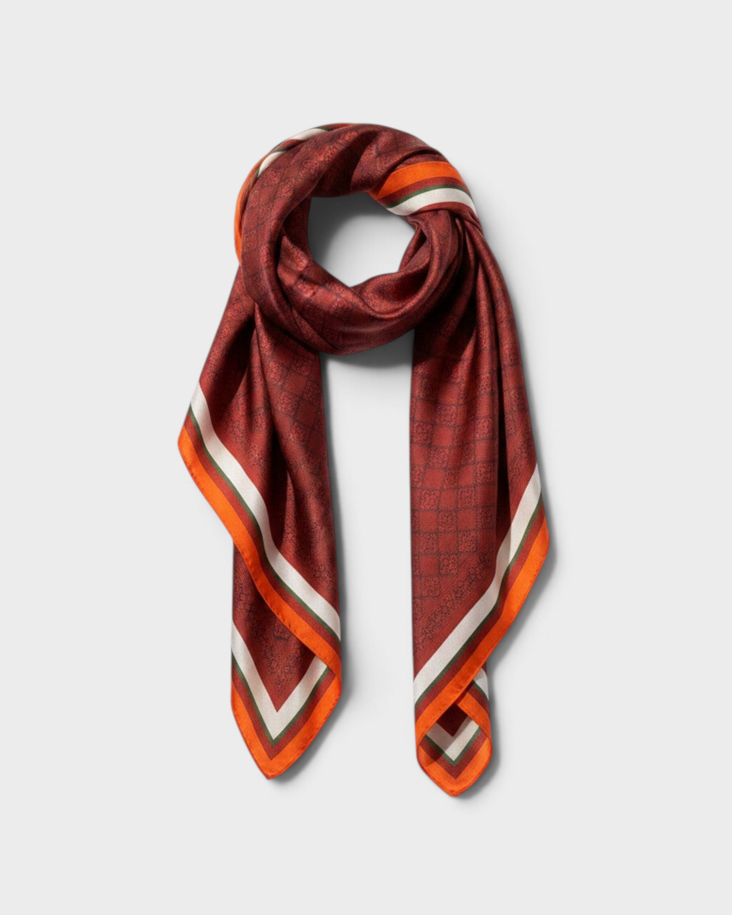 Montemaré Original Silk Square Scarf in a deep red grid pattern with orange, white, and green border accents.