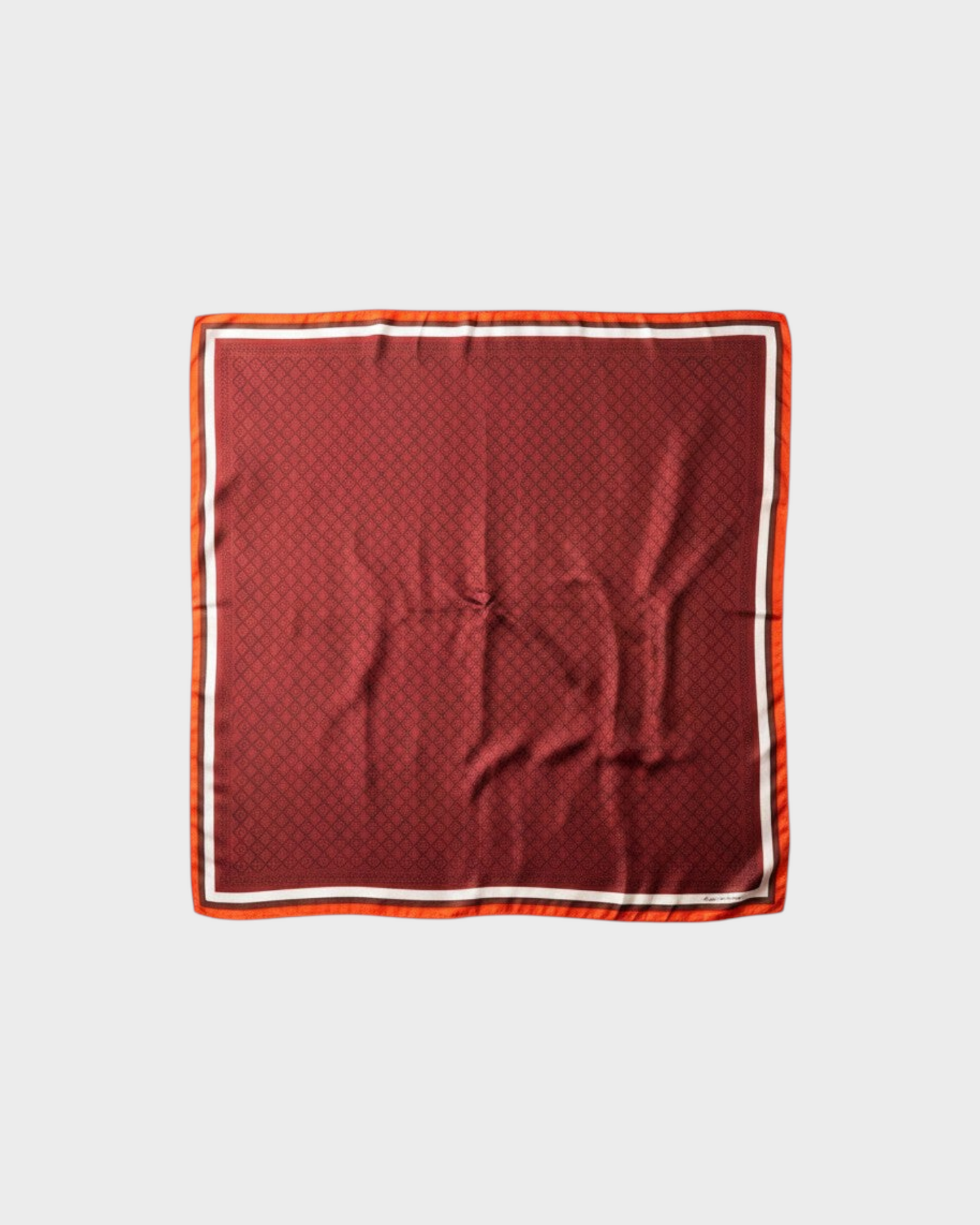 Montemaré Original Silk Square Scarf in red with a signature grid pattern and orange border details.