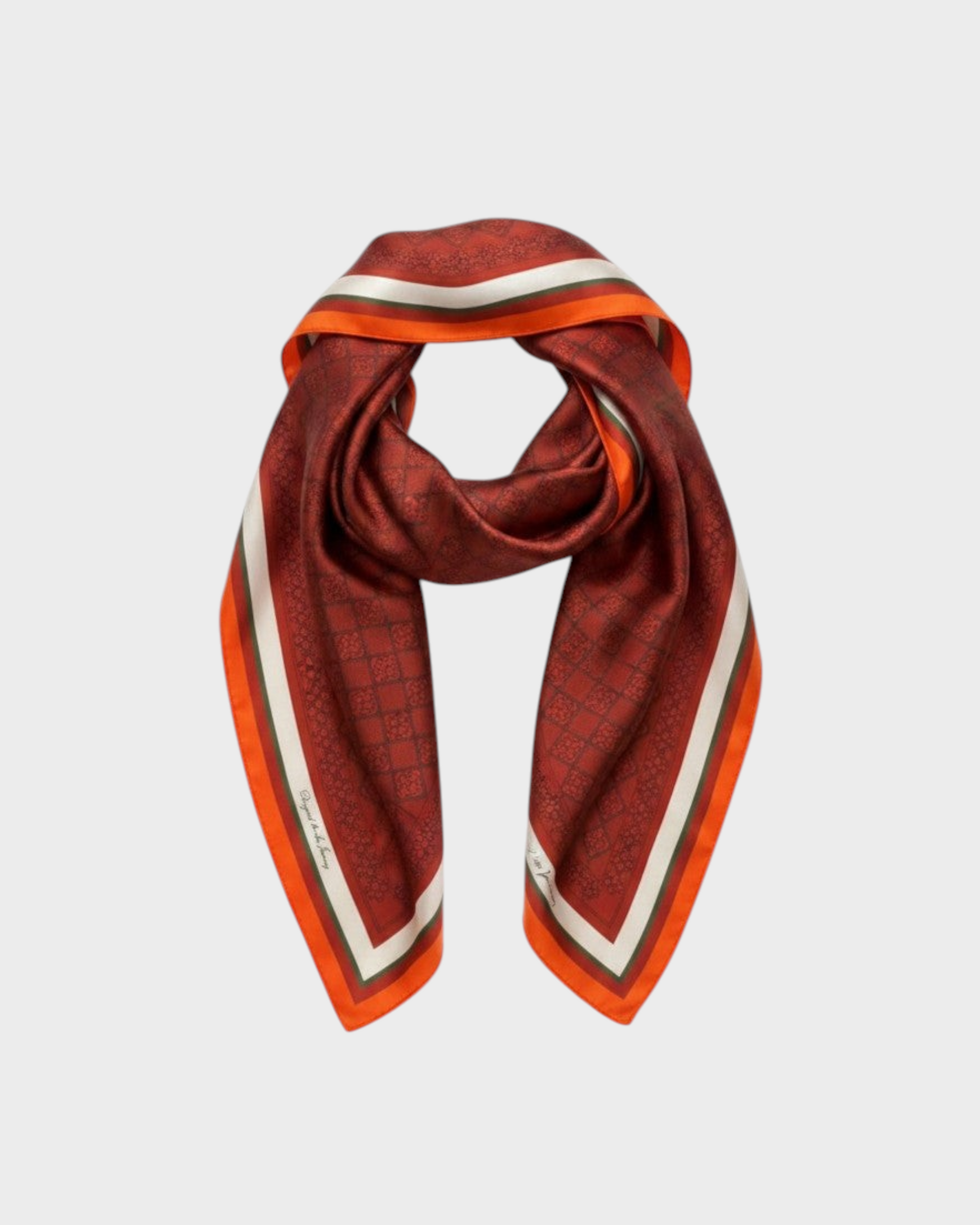 Montemaré square silk scarf in deep red with a signature grid pattern, orange border, and white stripe accents.