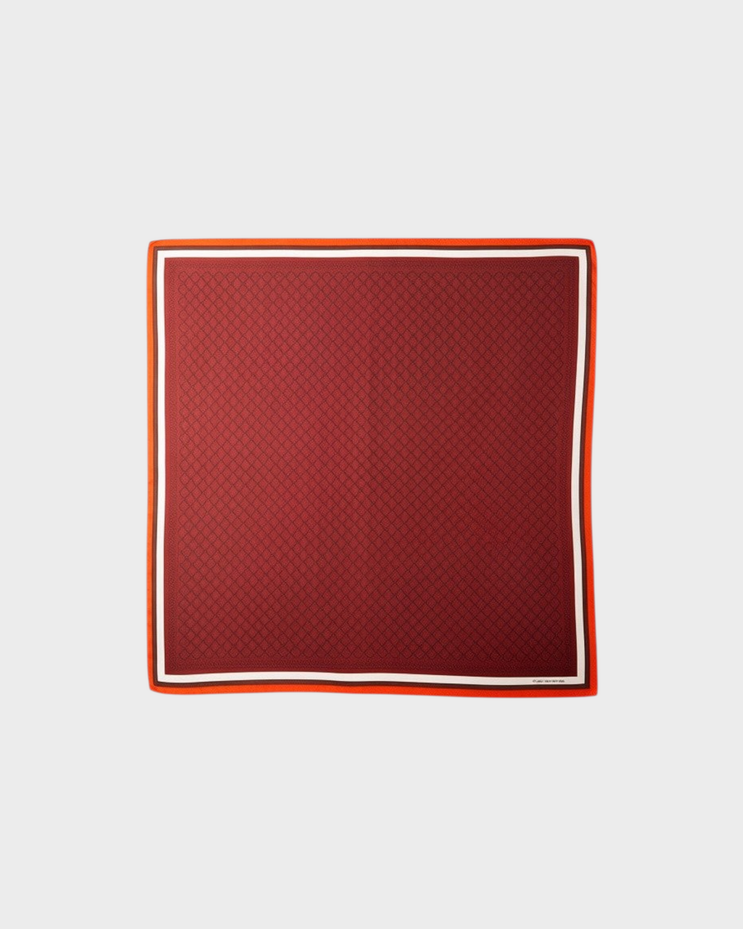 Montemaré square silk scarf in deep red with a signature grid pattern and orange and white border accents.