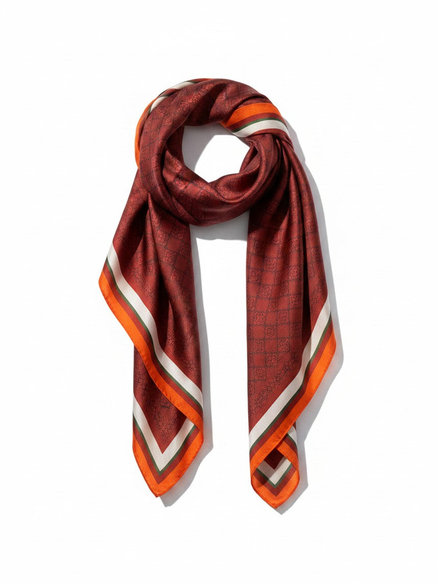 Montemaré Original silk square scarf in deep red with a geometric pattern and orange, white, and green border stripes.