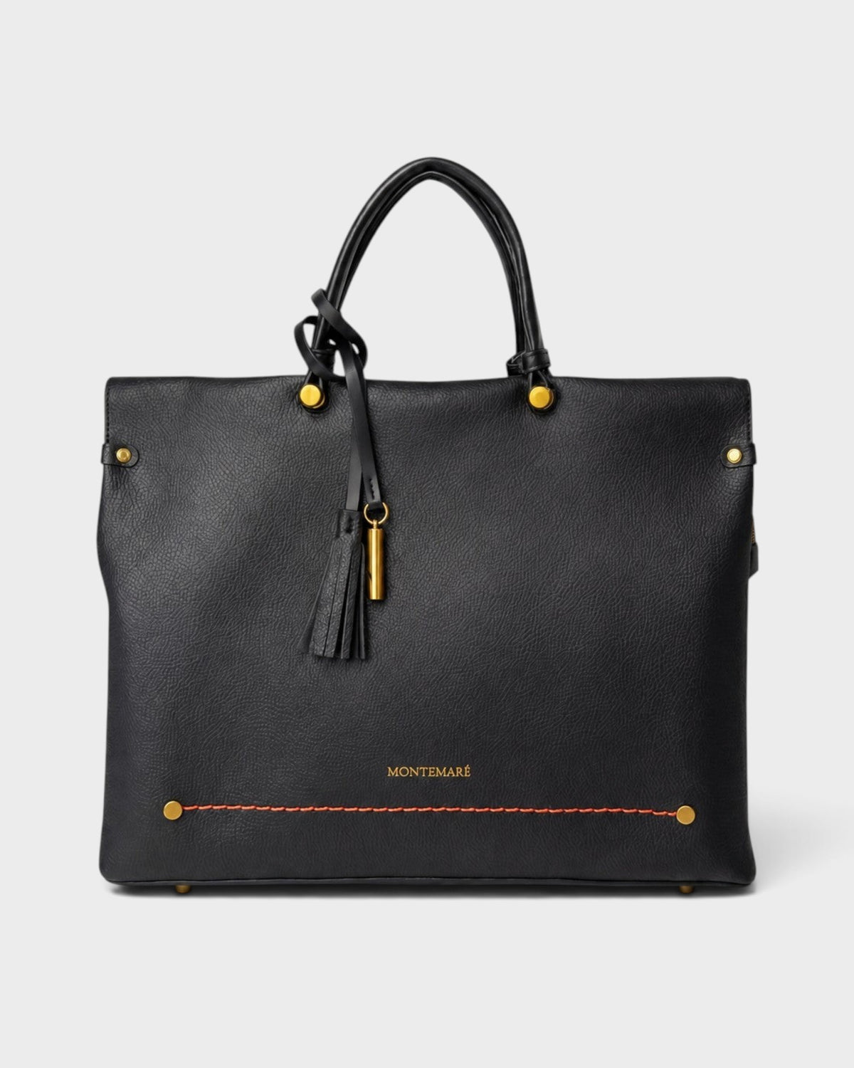 Montemaré Vienna black vegan leather carry-on tote with gold hardware, tassel detail, and reinforced handles.