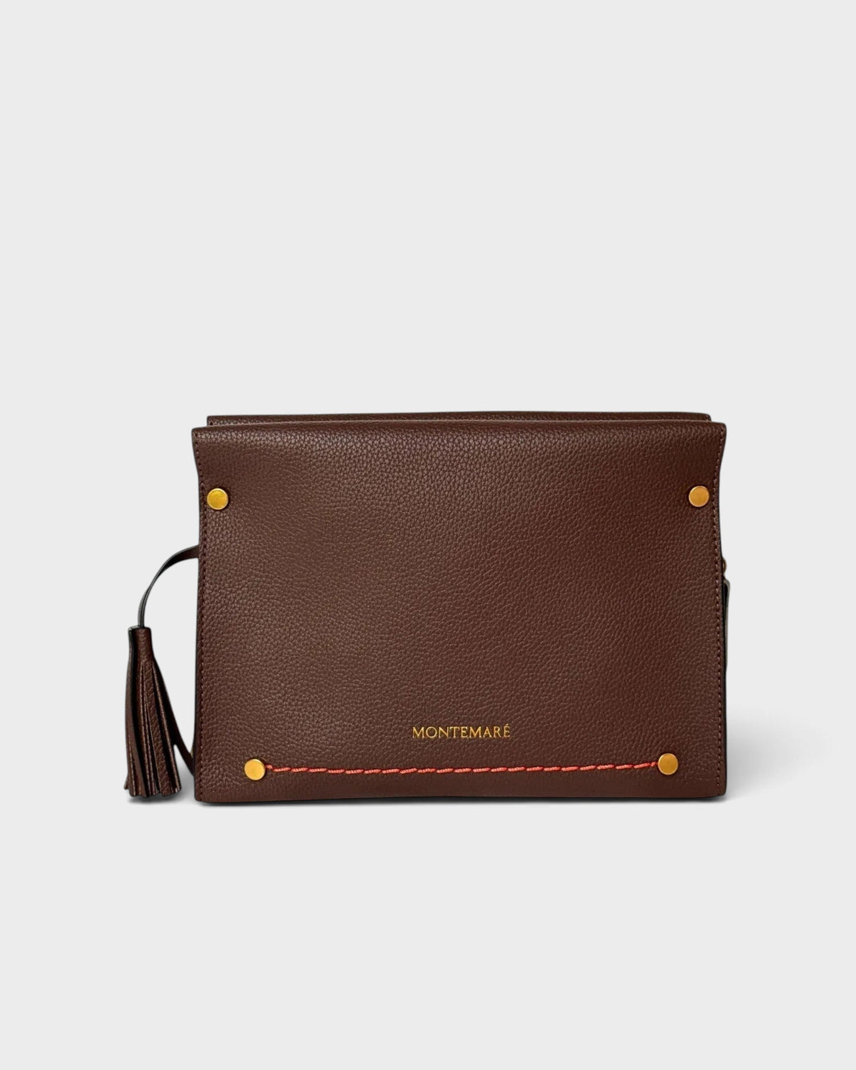 Montemaré Vienna Crossbody in brown pebbled vegan leather with gold hardware and a decorative safety whistle tassel.