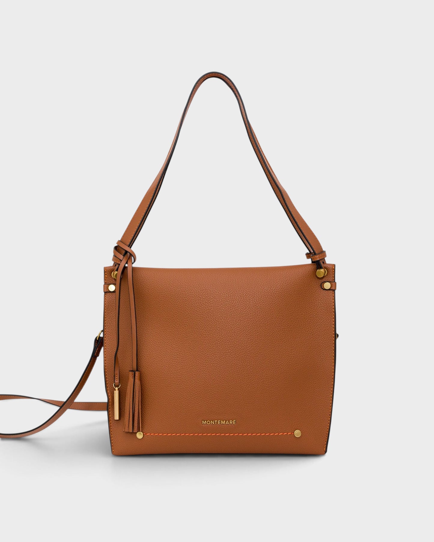 Montemaré Vienna shoulder bag in brown pebbled vegan leather with a signature whistle tassel and adjustable strap.