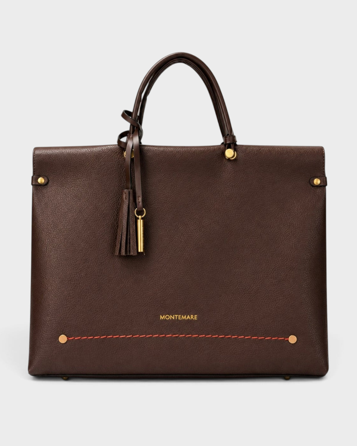 Montemaré Vienna small carry-on tote in dark brown vegan leather with a safety whistle tassel and gold hardware.