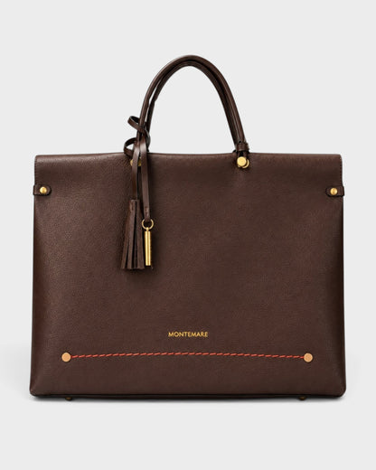 Montemaré Vienna small carry-on tote in dark brown vegan leather with a safety whistle tassel and gold hardware.