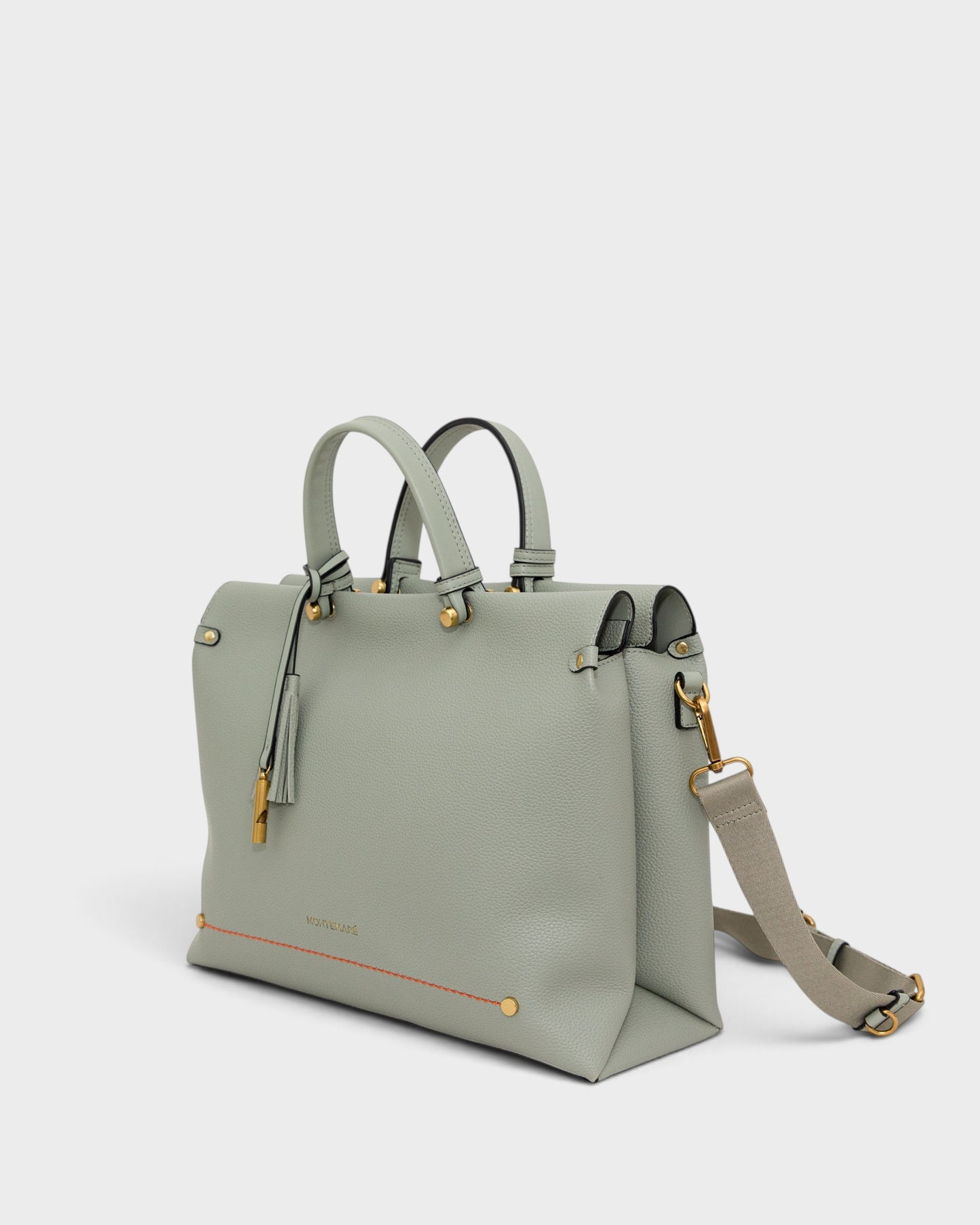 Montemaré Vienna small sage green vegan leather carry-on tote with gold hardware, tassel, and adjustable strap.