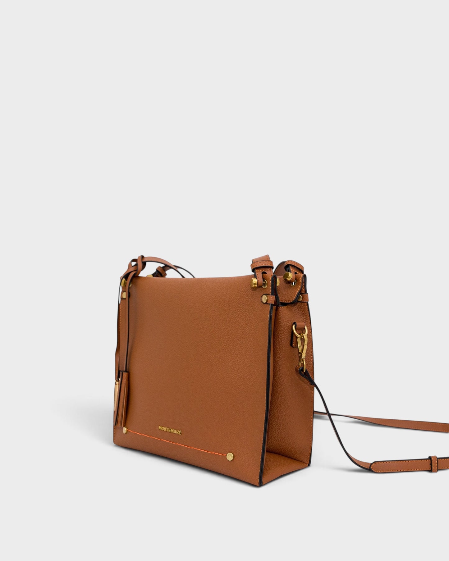 Montemaré Vienna shoulder bag in tan pebbled vegan leather with a safety whistle tassel and adjustable strap