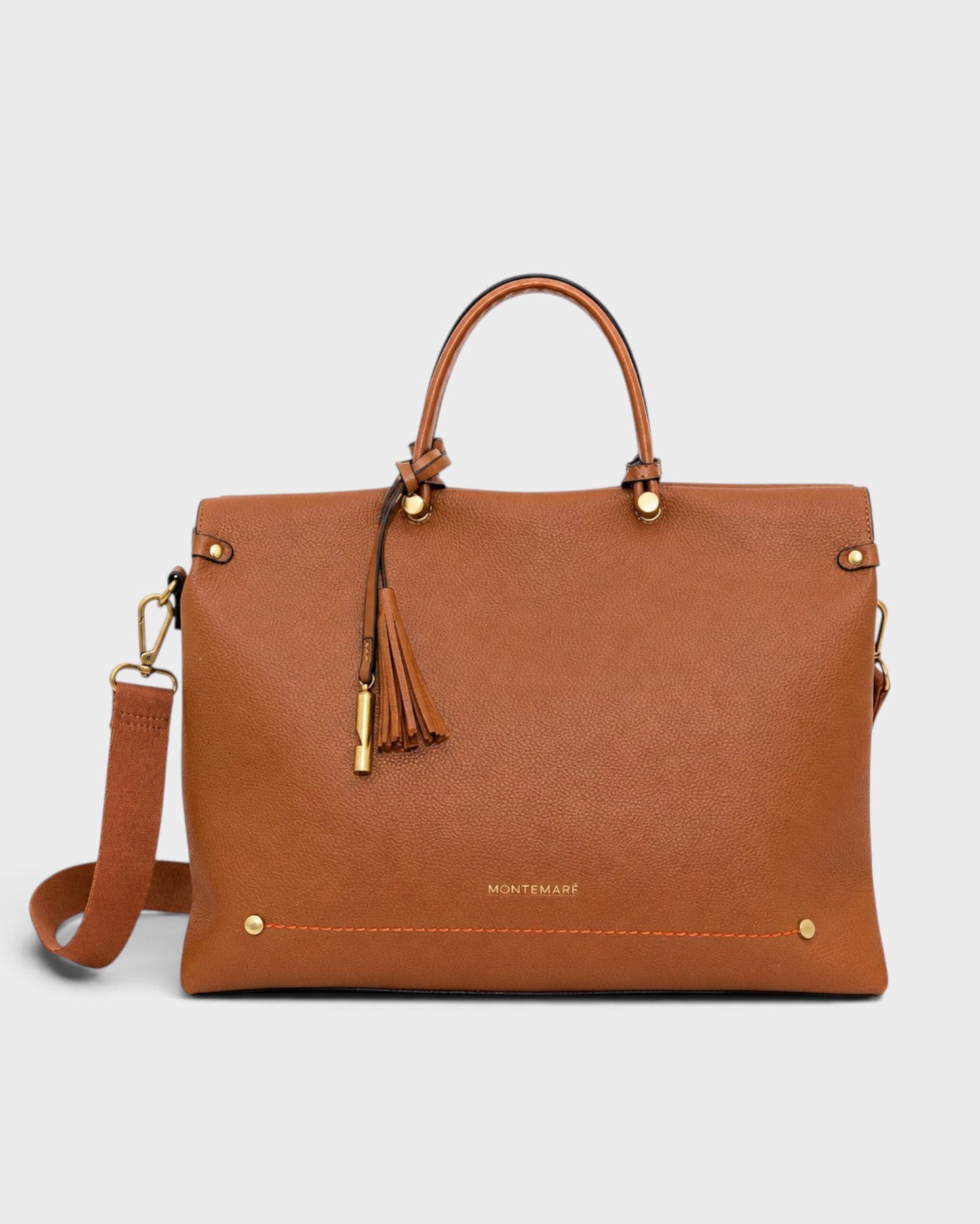 Montemaré Vienna small carry-on tote in tan vegan leather with a safety whistle tassel and adjustable crossbody strap.