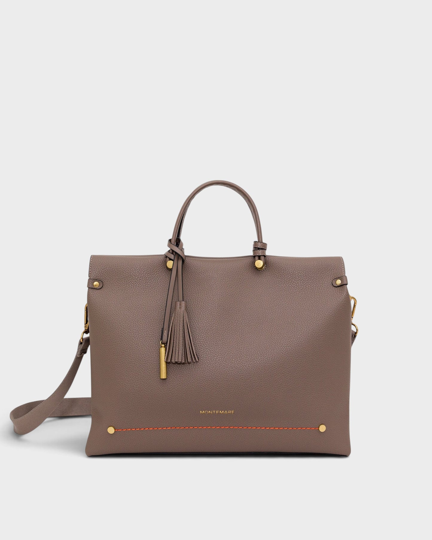 Montemaré Vienna small carry-on tote in taupe vegan leather with a tassel, gold hardware, and adjustable crossbody strap.